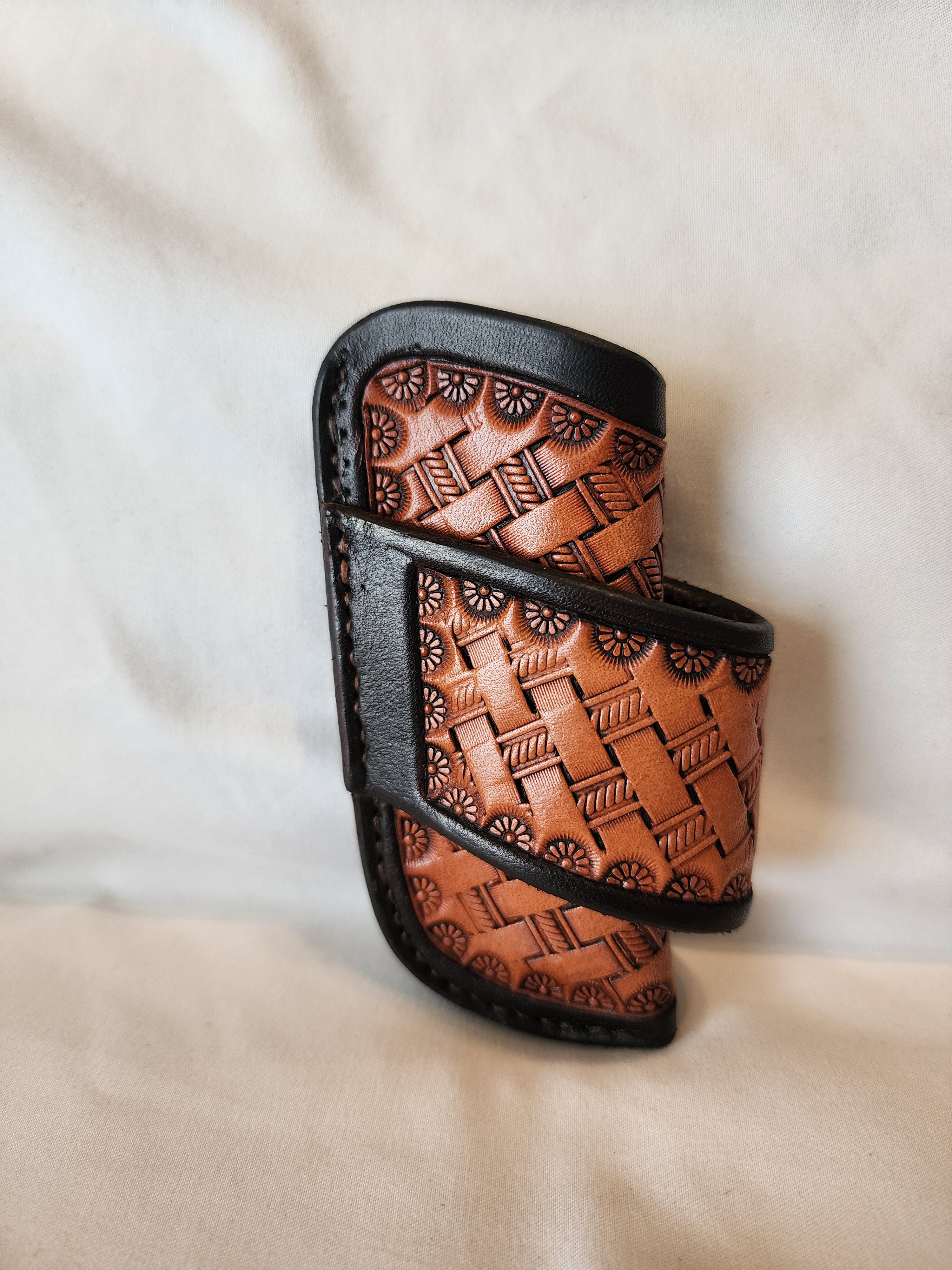 Handmade leather knife sheath with basketstamp tooling by Starlight Leather Co.