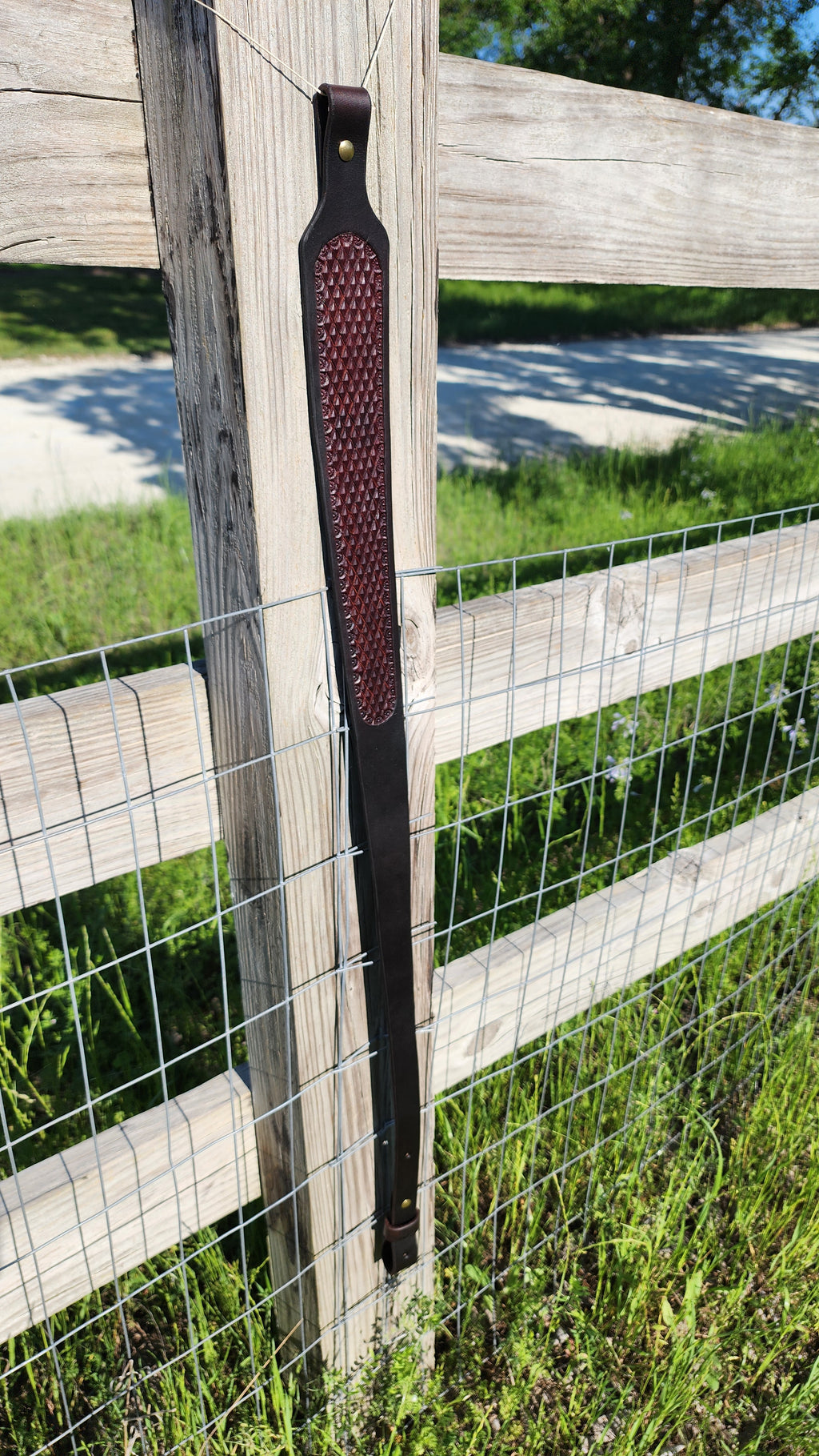 Handcrafted two-tone leather rifle sling with diamond stamping by Starlight Leather Co.