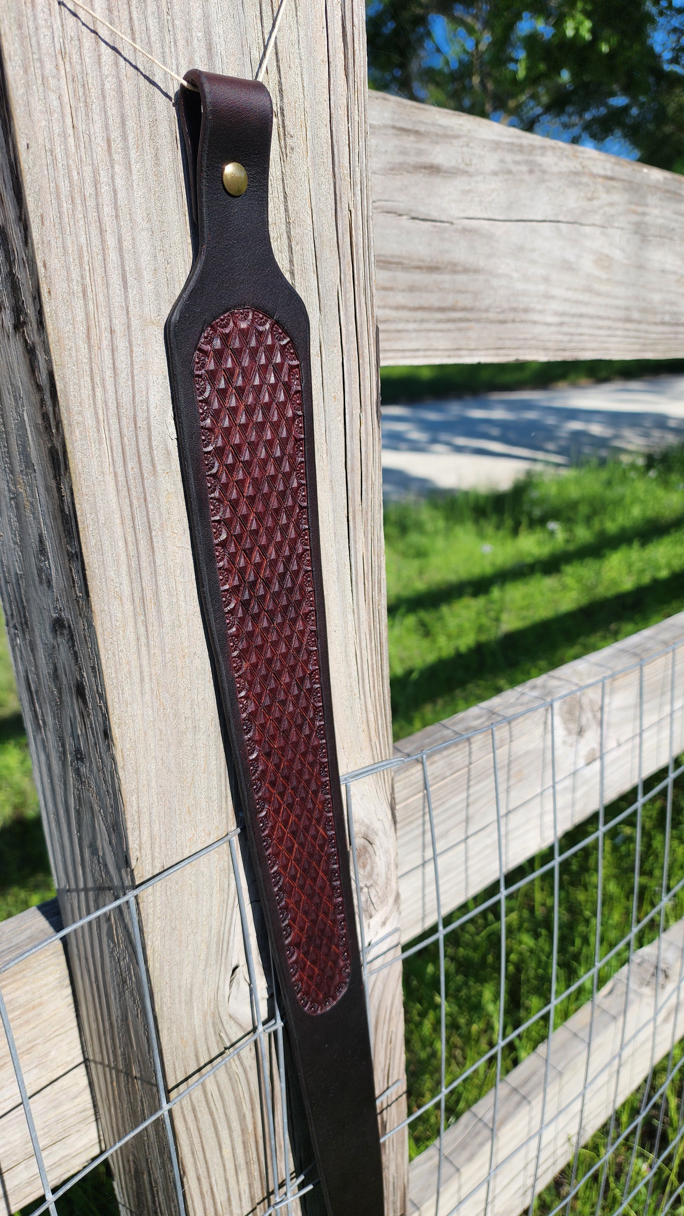 Handcrafted two-tone leather rifle sling with diamond stamping by Starlight Leather Co.