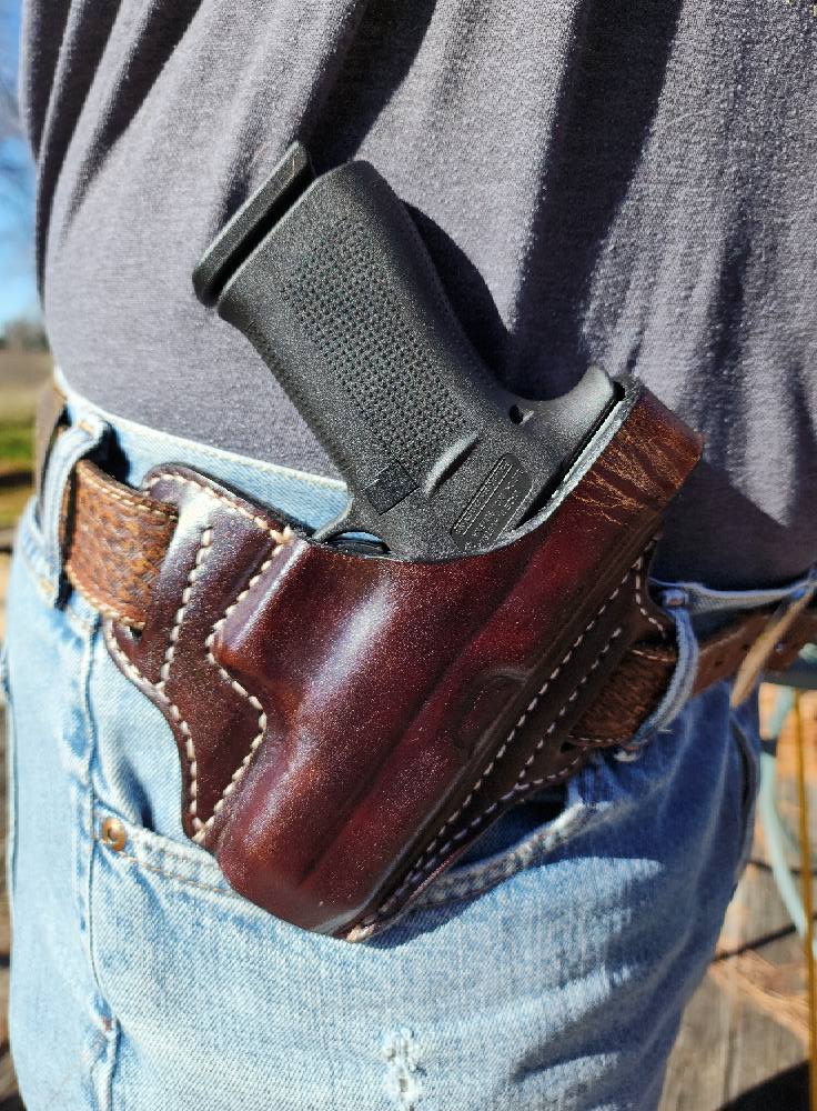 Brown handmade leather holster by Starlight Leather Co.